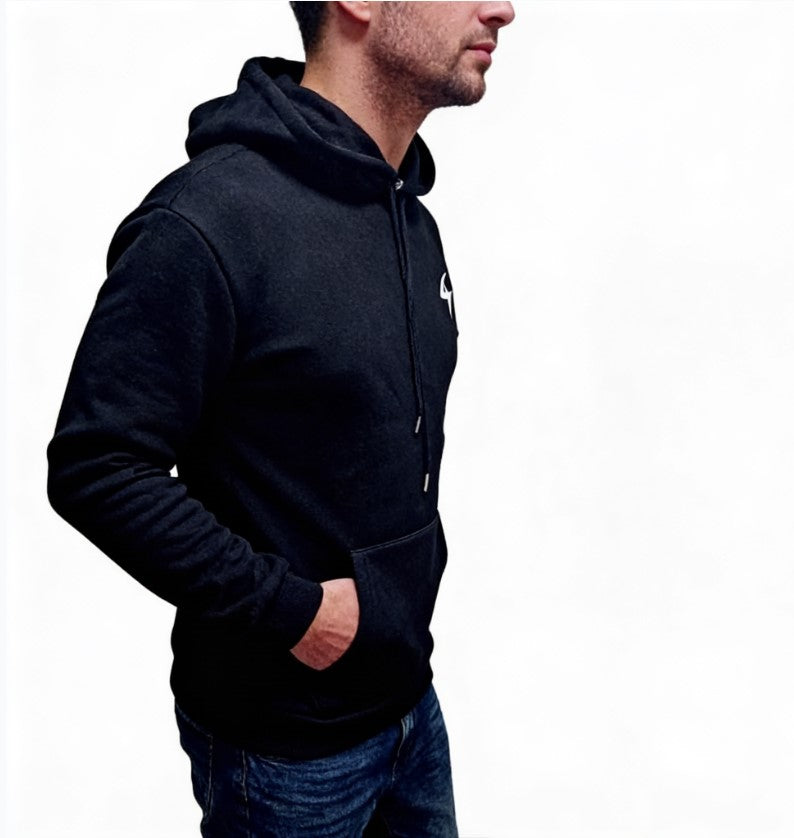 Person wearing a black hoodie with a white logo on a white background