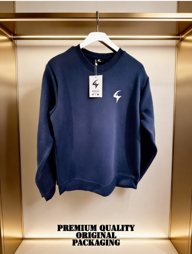 Navy blue sweatshirt with a brand logo on a hanger against a gold background