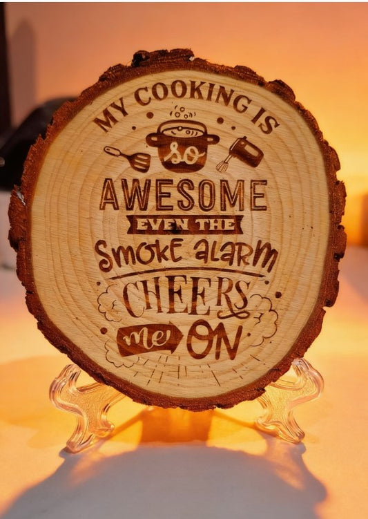 Wooden round sign with engraved text on a stand, glowing warmly.